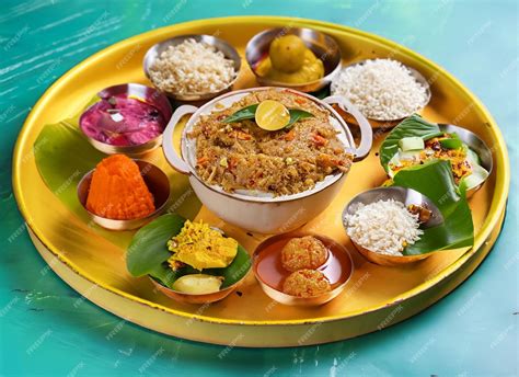 Premium Photo Onam Feast Eating Onasadya In Banana Leaf During The