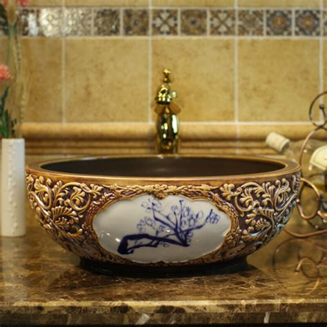 China Artistic Handmade Engraving Ceramic Wash Basin Lavobo Round