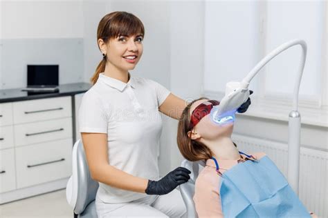 Dentist With Patient During Teeth Whitening Modern Dental Clinic