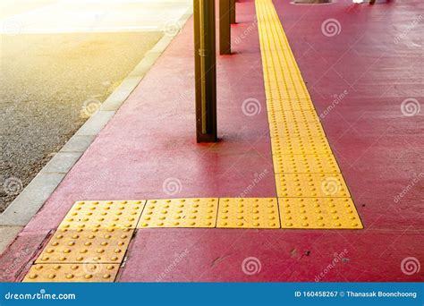 Yellow Dot Tactile Paving For Blind Handicap On Tiles Pathway In Japan