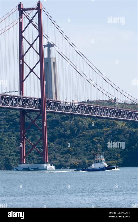 Tug River Tagus A Tug Under Ponte De Abril Bridge And Santu Rio De