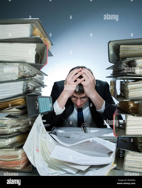 Overworked Man In The Office Stock Photo Alamy