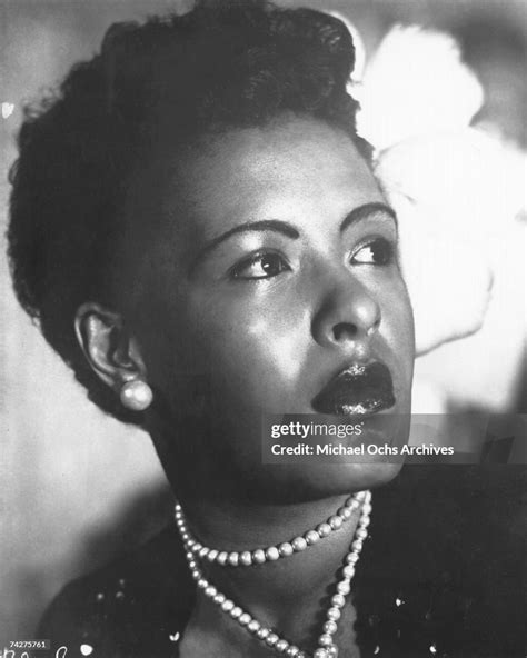 Jazz Singer Billie Holiday Poses For A Portrait In Circa 1939 With A