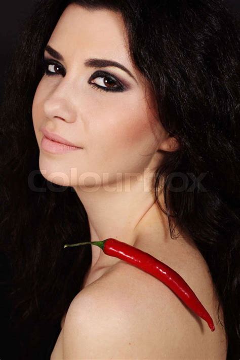 Sexy Nude Brunette Girl With Red Cayenne Isolated On Black Colourbox