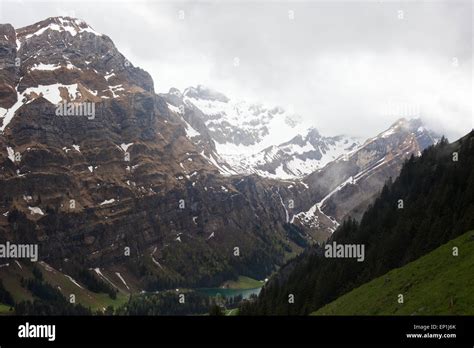 Alpstein, Seealpsee, Appenzell mountains in low cloud Stock Photo ...