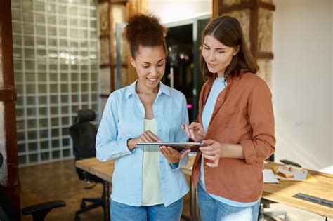 Premium Photo Female Coworkers Planning Strategy On Digital Tablet