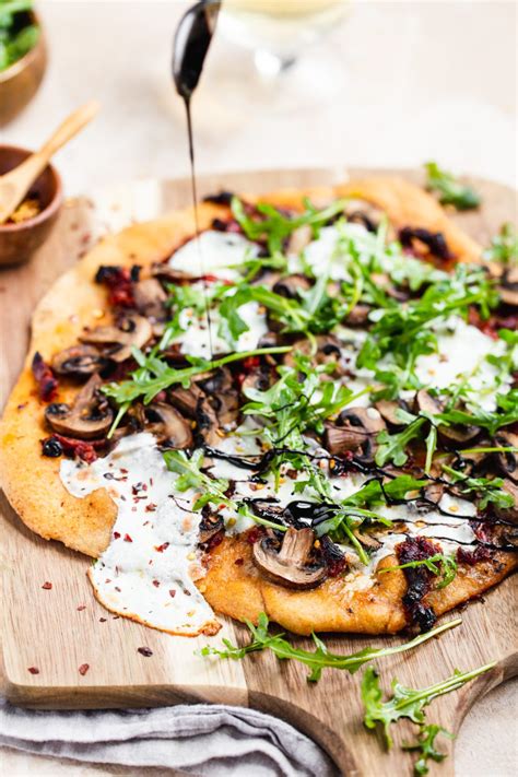 Sun Dried Tomato Mushroom Pizza With Arugula And Balsamic Vinegar