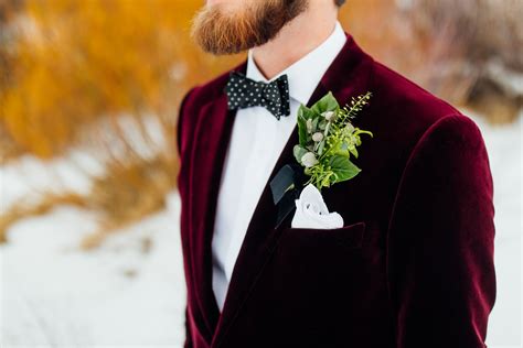 Winter Groom In Burgundy Suit Jacket With Polka Dot Bow Tie