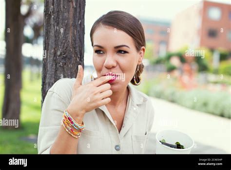 Woman Licking Finger Eating Hi Res Stock Photography And Images Alamy