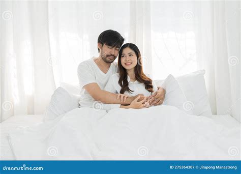 Asian Romantic Couple In Bed Enjoying Sensual Foreplay Happy Sensual