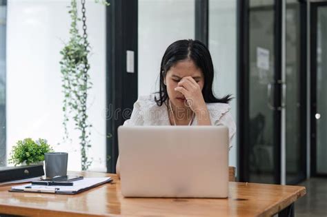 Burnout Or Tired Business Woman Is Sleepy In The Office From Deadlines Overworked Or