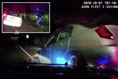 Drunk Motorist Drives Over Hood Of A Cop Cruiser And Nearly Hits Two