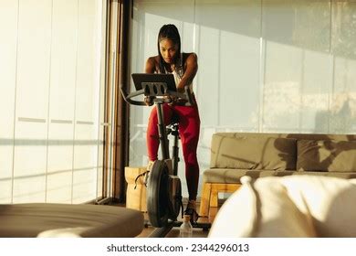 Home Gym Workout Cycling Helps Black Woman Achieve Fitness Goals Photos and Images | Shutterstock