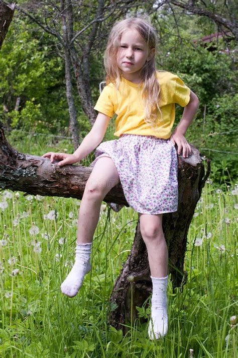 Kid Girl Putting On Shoes On Swing Stock Photo Image Of Cute Grass