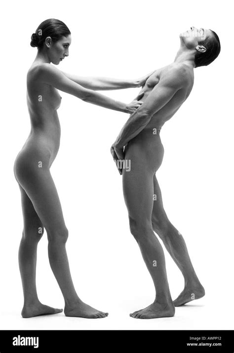 Nude Man And Woman Woman Keeping Man At Arms Length Side View B W Stock Photo Alamy