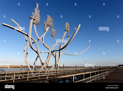 The Metal Sculpture Spirit Of The Staithes With A Row Of Wind Turbines