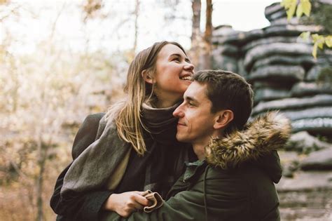 Premium Photo Smiling Couple Embracing Outdoors