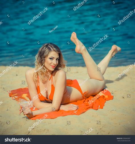 Girl Orange Bikini Sunning On Beach Stock Photo 295045397 Shutterstock