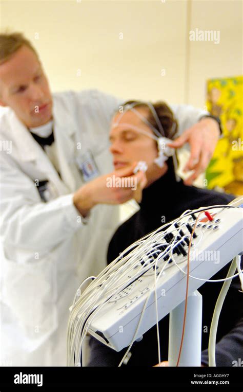 Measuring brain waves with EEG machine Stock Photo - Alamy