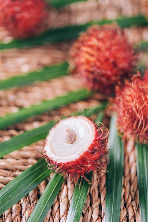 Rambutan Fruits With Palm Leaves On Rattan Background Top View Copy