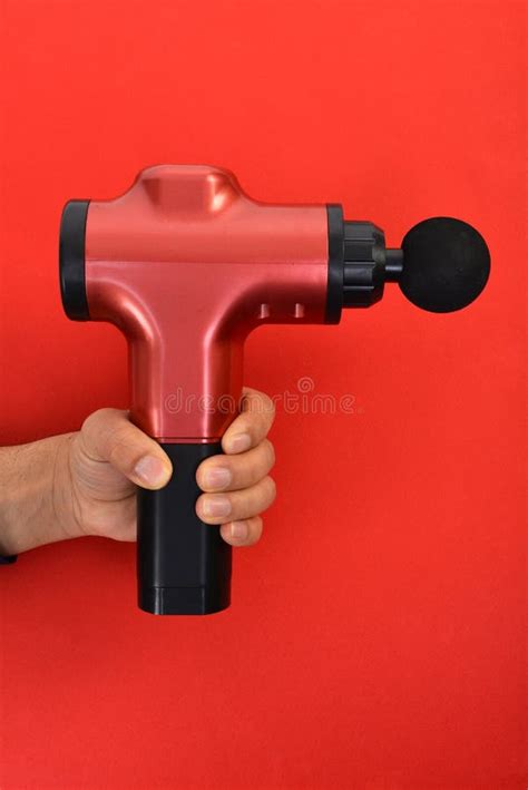 Massage Gun For Athletes Portable Body Muscle Massager Stock Photo