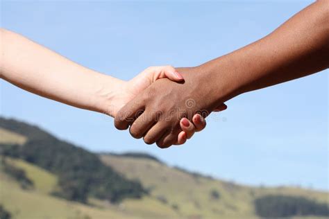 Shaking Hands For Peace Stock Image Image Of Mountain 23035703