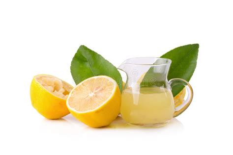 Glass Bowl Of Freshly Squeezed Lemon Juice Lemon Squeezer And R Stock