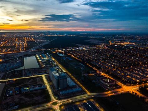 Premium Photo | Aerial view of cityscape during sunset