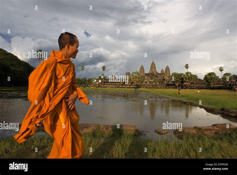 A Buddhist Monk On The Outside Of The Temple Of Angkor Wat The Plan Of