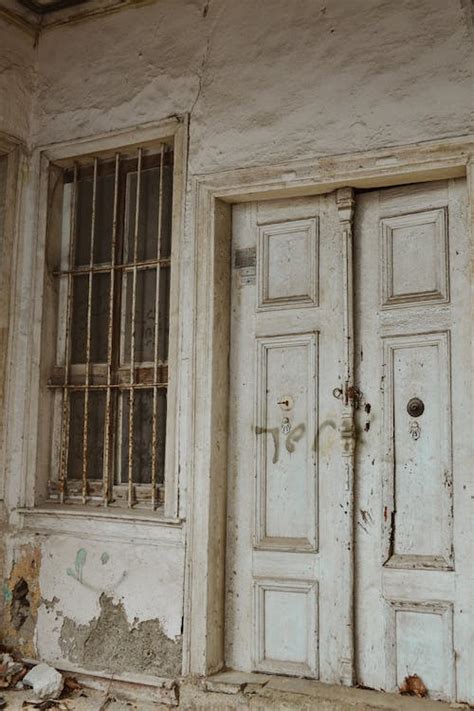 An Old White Wooden Door Of A House · Free Stock Photo