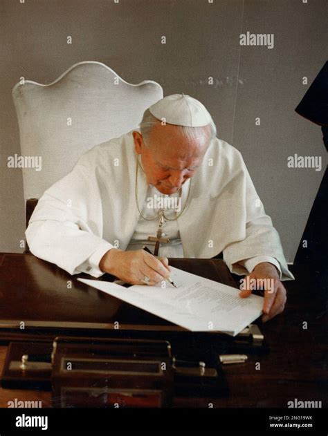 Pope John Paul II signs the encyclical ''Evangelium Vitae'' at the Vatican, March 30, 1995. (AP ...