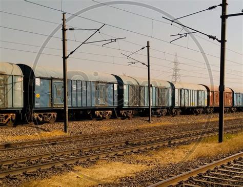 Image Of Electric Poles In An Railway Station Compound With Tracks And