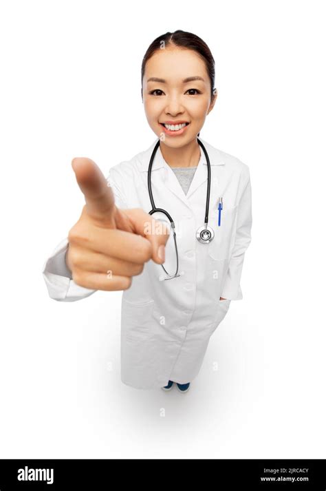 Happy Asian Female Doctor Pointing To Camera Stock Photo Alamy