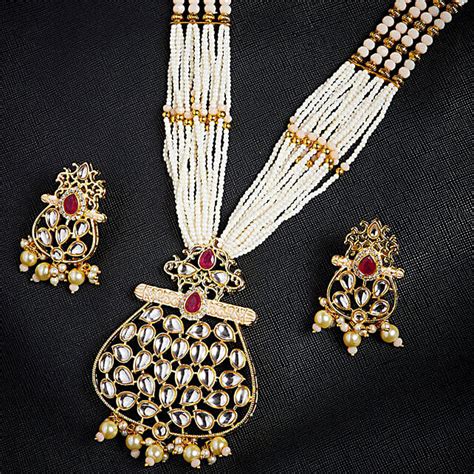 Buy Send Gold Toned And Peach Kundan Stone Studded Jewellery Set Online