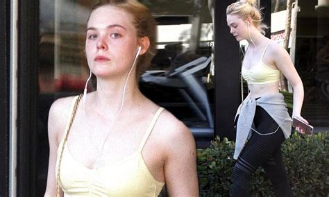 Elle Fanning Displays Her Toned Tummy In Yellow Sports Bra Daily Mail