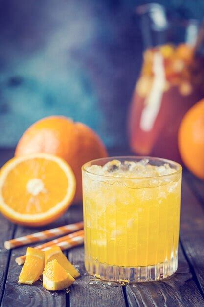 Premium Photo Glass Jar Of Fresh Orange Juice With Ice And Fresh