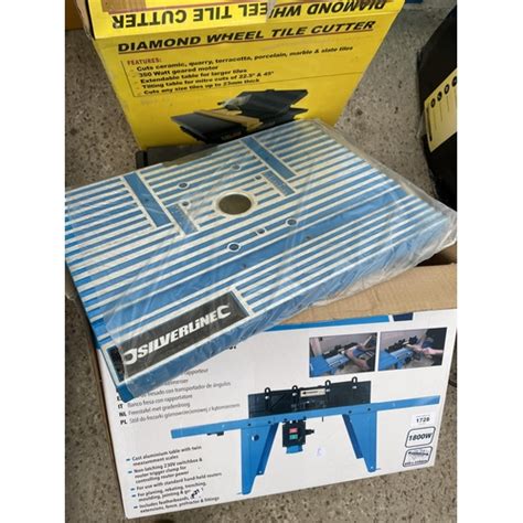 A Boxed Silverline Router Table And A Tile Cutter