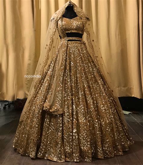 Gold Bridal Lehenga With Heavy Flared Bottom And Two Dupattas Ricco India