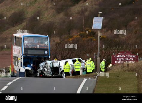 Emergency Services Attend The Scene Of A Crash Between A Bus And A 4x4