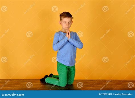 A Boy Prays Kneeling Religious And Devout Children Stock Photo Image