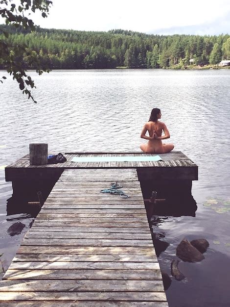 Premium Photo Woman Doing Yoga Naked On Wooden Jetty In Lake