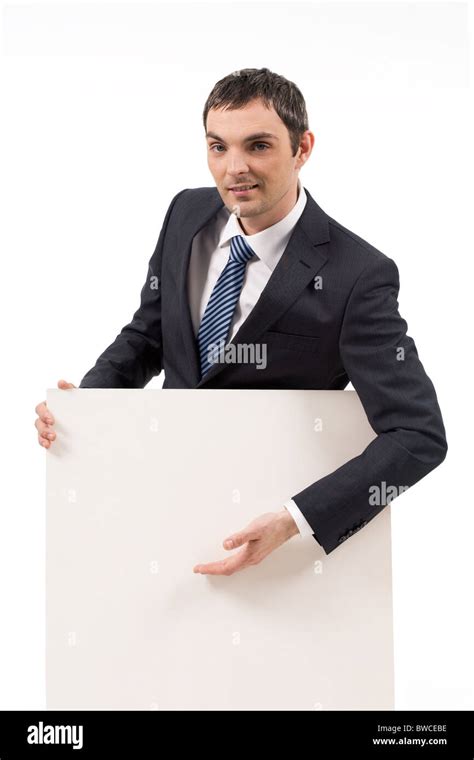 Image Of Successful Male Keeping Hand On Blank Paper And Looking At