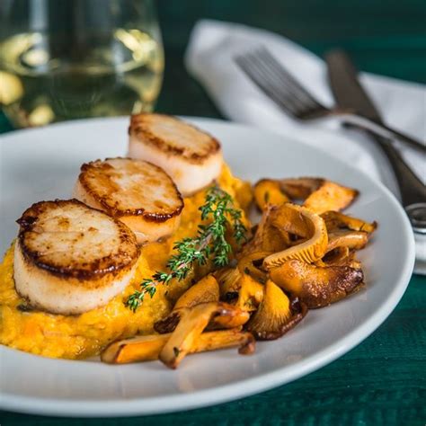 Seared Scallops With Sweet Potato Grits And Chanterelle Mushrooms