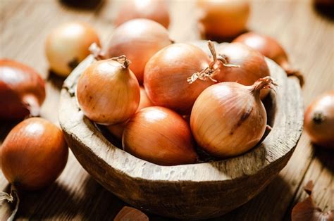 Premium Photo Fresh Onions On Rustic Background