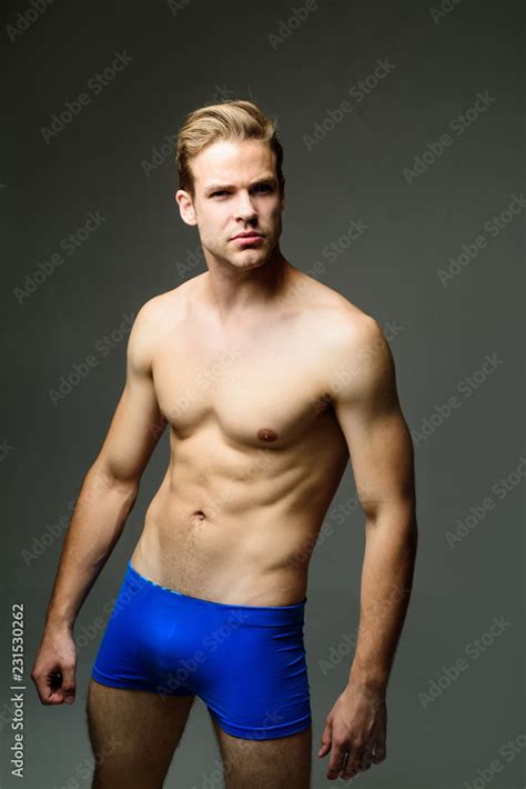 Handsome Sexy Sporty Man Muscular Man With Naked Torso Wearing Blue