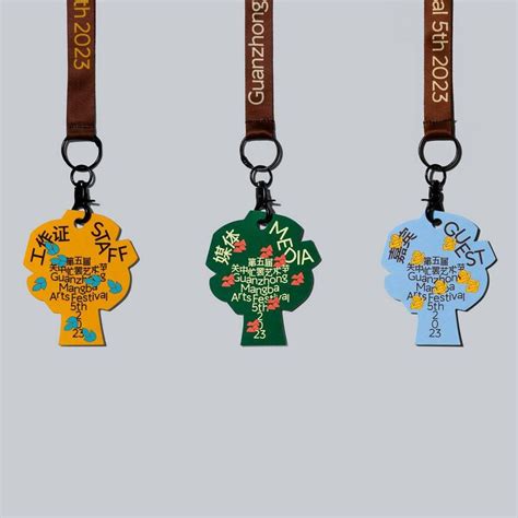 Three Key Chains With Different Designs And Colors On Each Lanyard One