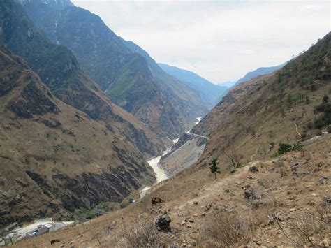 The Jinsha River slices between snowcapped mountains over 5,000 meters ...