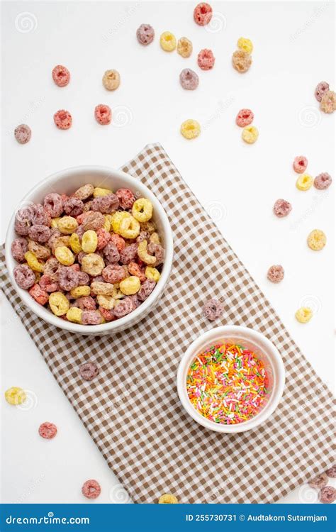 Healthy Food Concept Colorful Ring Cereal In Bowl And Sugar Topping In Mini Bowl On Gingham