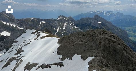 A view of the top of a mountain with snow on it photo – Free Säntis Image on Unsplash