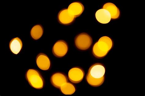 Premium Photo Golden Bokeh On Black Background Blurred Lights